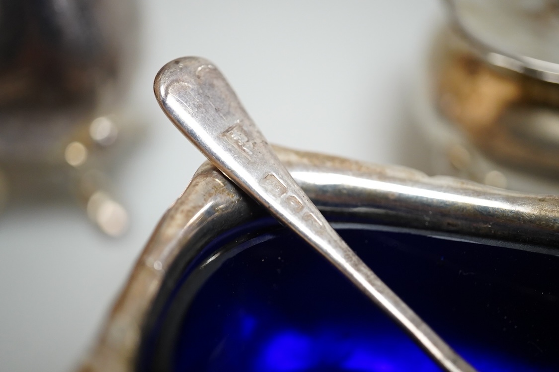 Four assorted silver salts, a silver mustard pot and two silver pepperettes, including Walker & Hall, Birmingham, 1900, some marks rubbed.